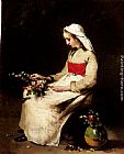 Theodule Augustine Ribot Canvas Paintings - A Girl Arranging A Vase Of Flowers